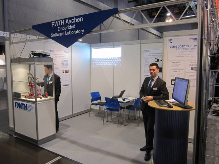 Mr Kalkov (left) and Mr Göbe at the Embedded Software Laboratory's stand.